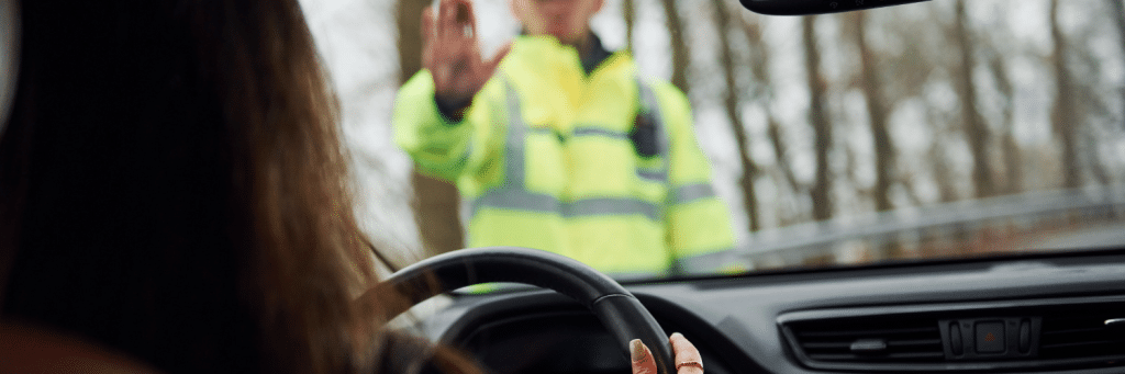 Police Officer Stopping Driver of a Car